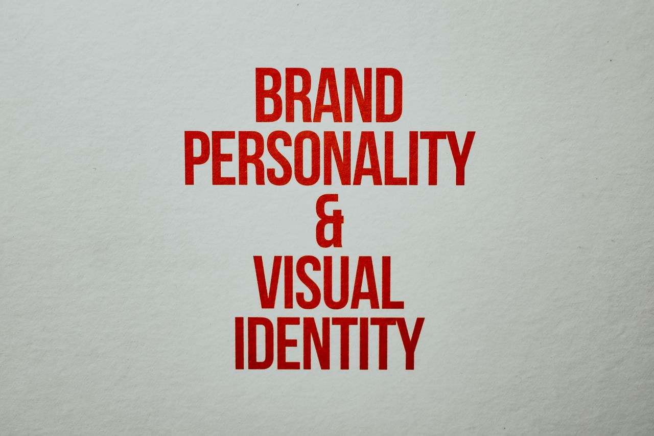 services-01 Red text emphasizing brand personality and visual identity on a neutral background.
